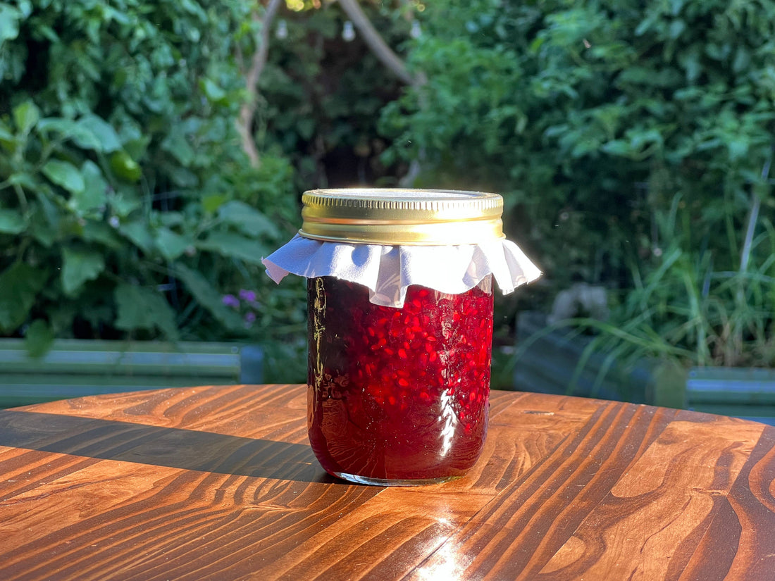 Jar of small-batch homemade jam from Farmer K Homestead, a unique realtor closing gift